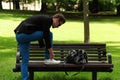 Trendy man tying his shoe Royalty Free Stock Photo