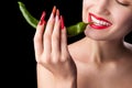 Trendy manicure and red lips with green chili pepper. Royalty Free Stock Photo