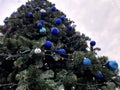 trendy modern Christmas tree with blue teeth made of glossy and