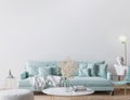 Trendy modern living room in light turquoise color and golden home accessories