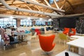 Trendy modern open concept loft office space with big windows, natural light and a layout to encourage collaboration