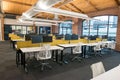 Trendy modern open concept loft office space with big windows, natural light and a layout to encourage collaboration Royalty Free Stock Photo