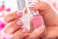 Trendy nail manicure. Woman hands holding nails polishes Royalty Free Stock Photo