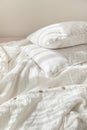 Trendy organic natural linen bedclothes with wooden buttons closeup. Bedding