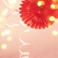 Trendy Paper coral decoration, serpentine and bokeh lights. Holiday party background