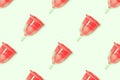 Trendy pattern of eco menstrual cup on a mint background