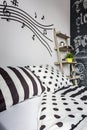 Trendy patterned bedroom with musical accents