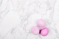 Trendy pink easter eggs on marble background
