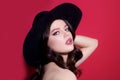 Trendy retro fashion. High-fashion portrait. Sexy sensual elegant woman in black hat. Isolated. Royalty Free Stock Photo