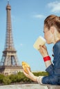 Trendy solo traveller woman having coffee cup and croissant Royalty Free Stock Photo