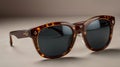 Trendy sunglasses with Mocha Mousse frames, placed on a clean background Royalty Free Stock Photo