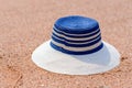 Trendy sunhat lying on beach sand Royalty Free Stock Photo