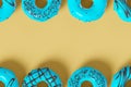 Trendy sunlight Summer pattern made with glazed donut with sprinkles on a yellow Royalty Free Stock Photo