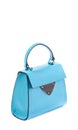 Trendy turquoise leather women\'s flap bag with top handle and silver accent and hardware on a white background