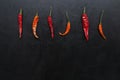 Trendy ugly hot chili peppers seamless pattern on a black background, Contrast, top view, square, trend, ugly, unusual