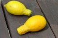 Trendy Ugly lemon. Strange shape fruits on wooden table outdoor, green garden background.