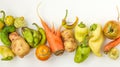 Trendy Ugly Vegetables: potatoes, carrots, cucumber, peppers and tomatoes on white background, ugly food concept