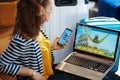 Trendy woman booking tickets laptop and using customer service