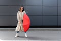 trendy woman in long coat and Royalty Free Stock Photo