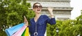 Trendy woman with shopping bags handwaving in Paris, France Royalty Free Stock Photo