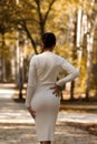 Trendy woman standing on path in park