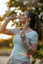 trendy woman in white shirt using nasal spray Royalty Free Stock Photo