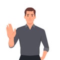 Trendy young business man making or showing stop gesture sign with hand, saying no. Shocked person warning signal with palm of the