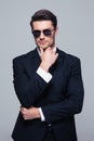 Trendy young businessman in sunglasses