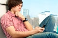 Trendy young guy typing a message Royalty Free Stock Photo