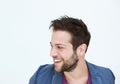 Trendy young man smiling on white background