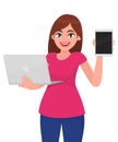 Trendy young woman holding a new laptop computer and showing digital tablet or pad. Stylish girl using digital device. Royalty Free Stock Photo