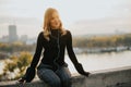 Trendy young woman listening music from smartphone outdoor at sunset Royalty Free Stock Photo