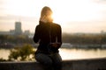 Trendy young woman listening music from smartphone outdoor at sunset Royalty Free Stock Photo