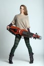 Trendy young woman musician holding a nyckelharpa