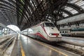 Trenitalia Silver Arrow high-speed train at a platform at Milan Train Station