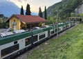 Trenord train leaving the Varenna-Esino-Perledo Train Station in Perledo, Italy.