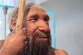A realistic reproduction of a prehistoric old man Royalty Free Stock Photo