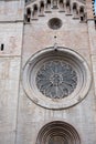 Rose window on the facade of Roman Catholic cathedral church in Trento, northern Italy Royalty Free Stock Photo