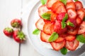 Mexican soaked cake topped with strawberries and cream