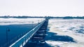 Winter Wisconsin trestle trail bridge over lake Royalty Free Stock Photo