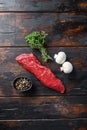 Tri tip steak with fresh seasoningsm thyme, for BBQ on wooden background, top view Royalty Free Stock Photo