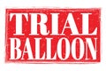 TRIAL BALLOON, words on red grungy stamp sign