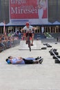 Trial biker jumping over 4 guys