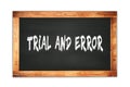 TRIAL  AND  ERROR text written on wooden frame school blackboard Royalty Free Stock Photo
