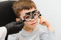 Trial frame. Glasses for a little boy. Hypermetropia. Ametropia correction with glasses Royalty Free Stock Photo