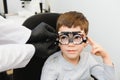 Trial frame. Glasses for a little boy. Hypermetropia. Ametropia correction with glasses