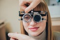 Trial frame. Glasses for a young woman. Ametropia correction with glasses. Royalty Free Stock Photo