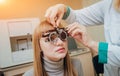 Trial frame. Glasses for a young woman. Ametropia correction with glasses. Royalty Free Stock Photo