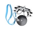 Trial frame and head mirror on white, top view. Ophthalmologist tools