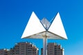 Triangle billboard or advertising poster with city and blue sky background Royalty Free Stock Photo